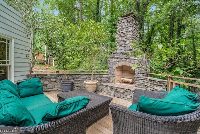 exterior space featuring an outdoor living space with a fireplace