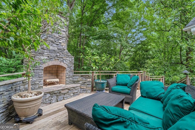 wooden deck featuring an outdoor living space with a fireplace