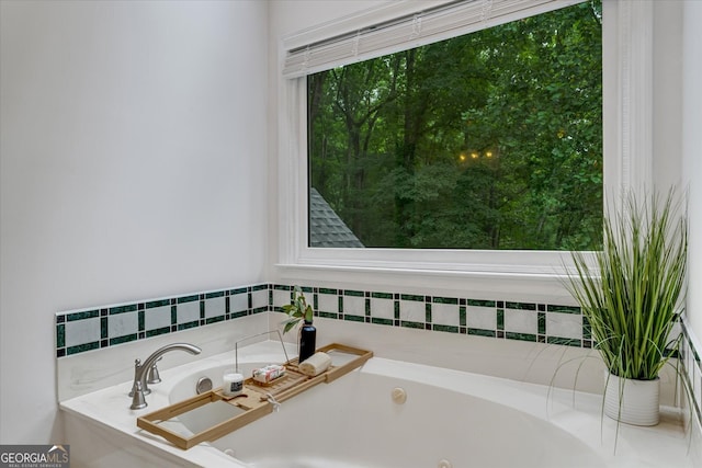 bathroom featuring tiled bath