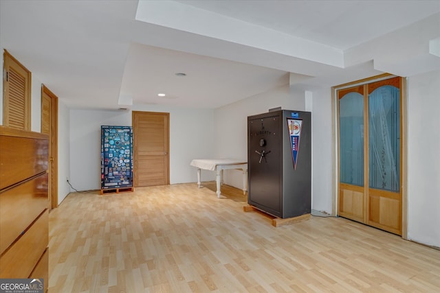 unfurnished bedroom with multiple closets and light hardwood / wood-style floors