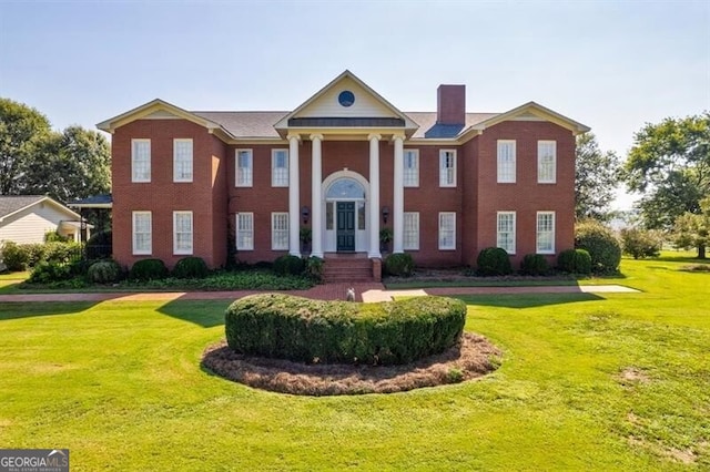 71 Taff Rd, Taylorsville, GA 30178 - greek revival inspired property with a front lawn and a chimney