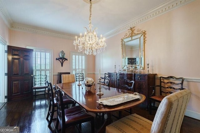 dining area with dark wood-type flooring, crown molding, and a chandelier