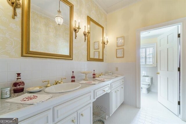 71 Taff Rd, Taylorsville, GA 30178 - full bathroom with tile walls, double vanity, toilet, a wainscoted wall, and ornamental molding