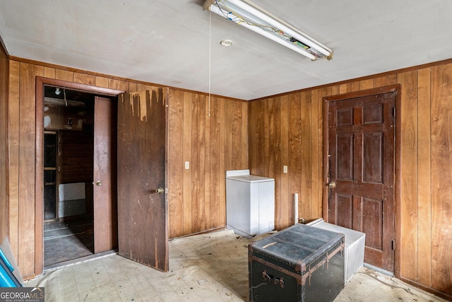 miscellaneous room with wooden walls