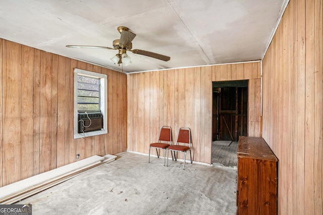 empty room with ceiling fan, cooling unit, and wood walls