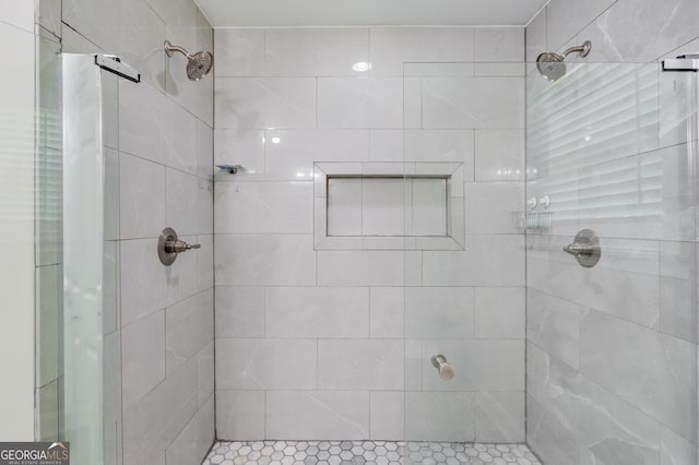 bathroom with tiled shower