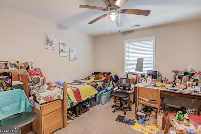 bedroom featuring ceiling fan and carpet