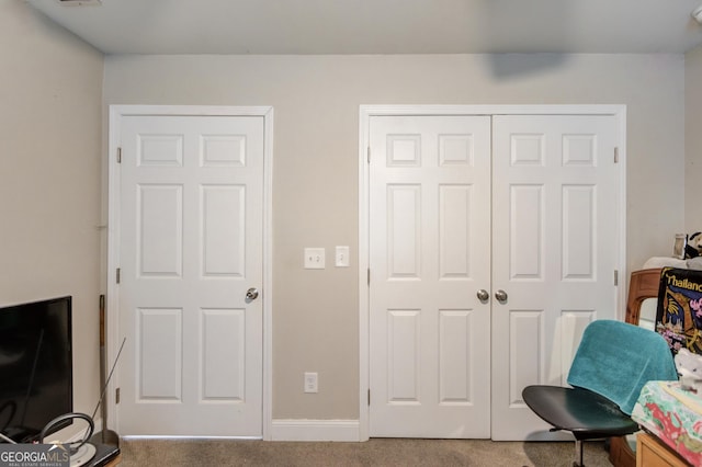 living area with carpet