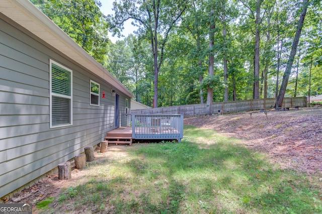 view of yard featuring a wooden deck