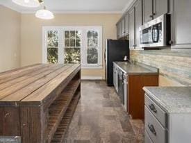 kitchen featuring pendant lighting, gray cabinets, and ornamental molding