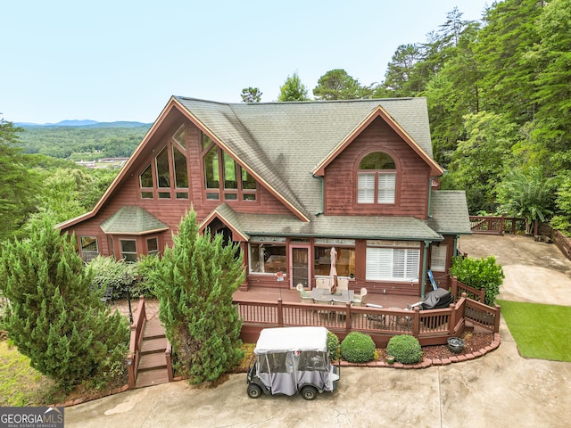 view of front facade with a wooden deck