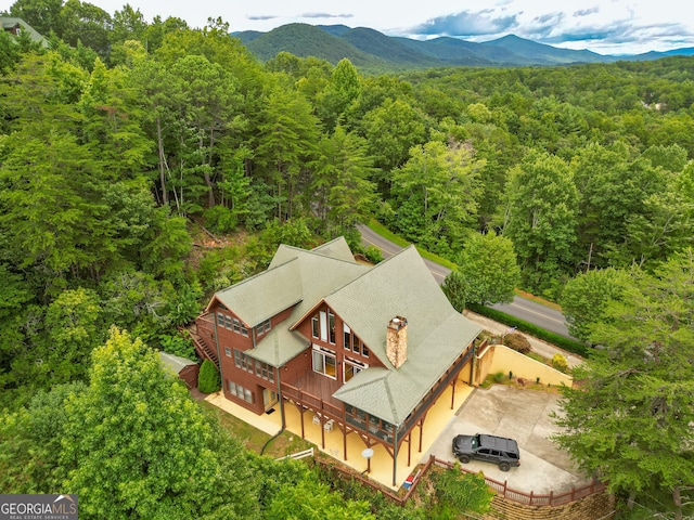 birds eye view of property with a mountain view