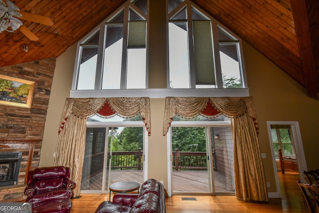 interior space featuring wood ceiling, ceiling fan, high vaulted ceiling, and hardwood / wood-style floors