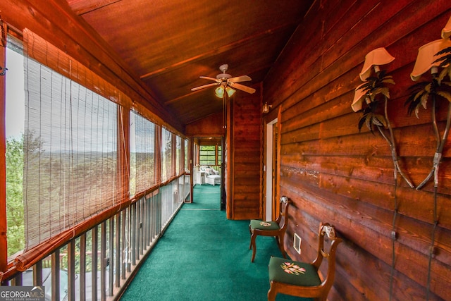 interior space featuring ceiling fan, lofted ceiling, and wood ceiling