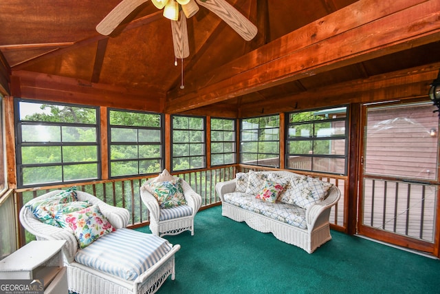 sunroom with ceiling fan and lofted ceiling with beams