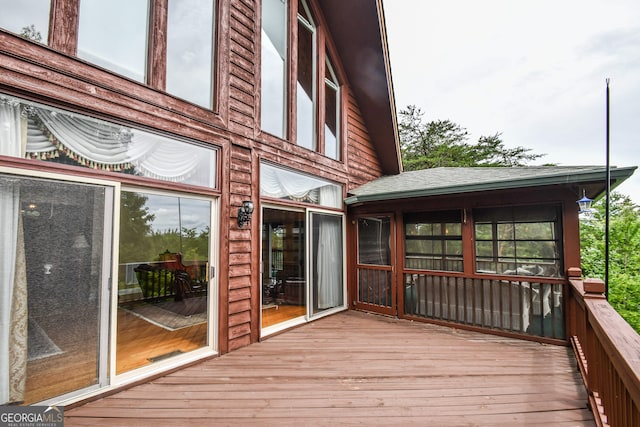 wooden terrace with a sunroom