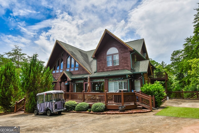 view of front of property featuring a wooden deck