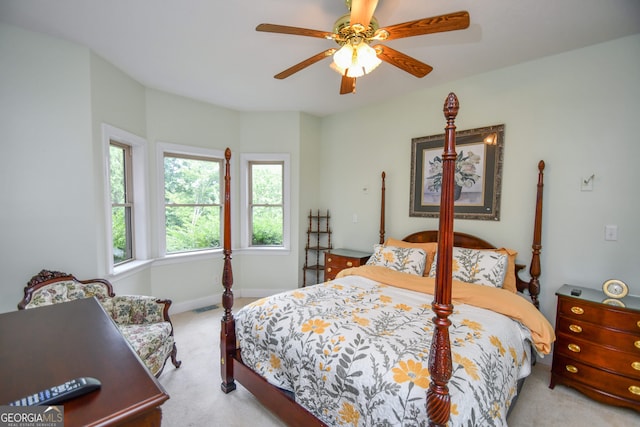 bedroom with light colored carpet and ceiling fan