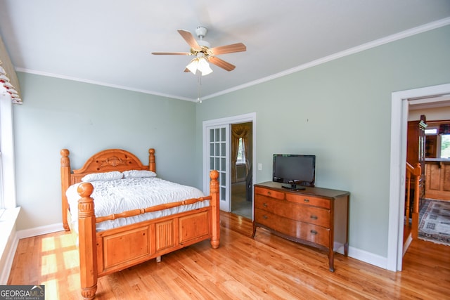 bedroom with crown molding and light hardwood / wood-style floors