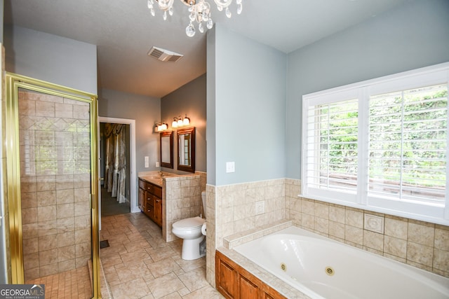 full bathroom with tile walls, a chandelier, separate shower and tub, vanity, and toilet