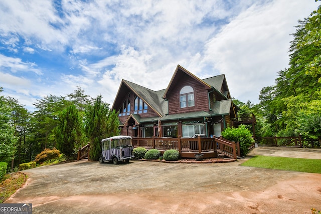 view of front of home featuring a wooden deck