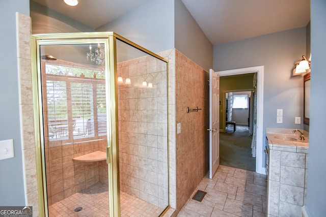 bathroom with an enclosed shower and vanity