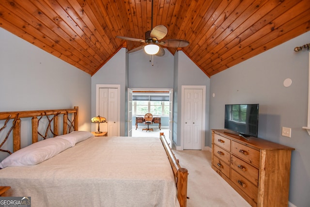 carpeted bedroom with multiple closets, vaulted ceiling, wooden ceiling, and ceiling fan