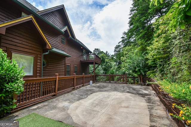 view of patio with a balcony