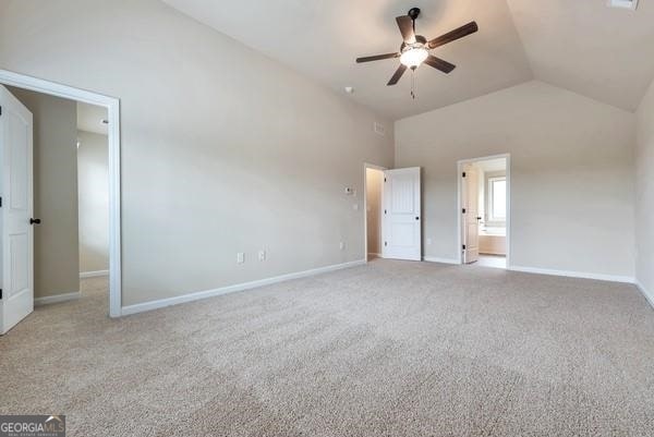 unfurnished bedroom featuring baseboards, high vaulted ceiling, a ceiling fan, and light colored carpet