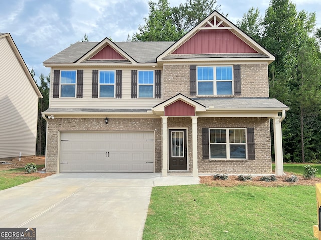 craftsman-style house with a garage and a front lawn