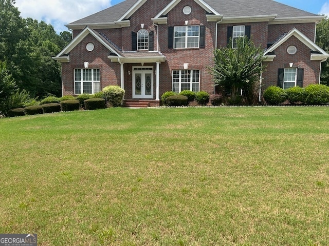 view of front of property featuring a front lawn