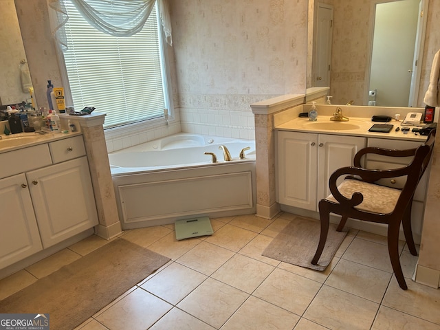 bathroom featuring vanity, tile patterned flooring, and a bathtub