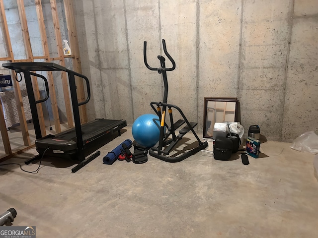 workout area featuring concrete floors