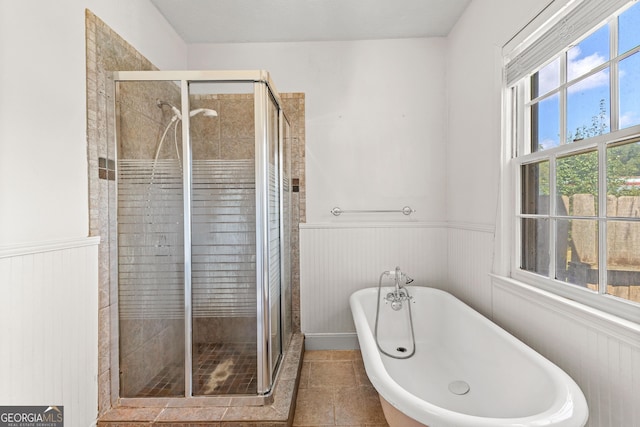 bathroom featuring separate shower and tub and tile patterned floors