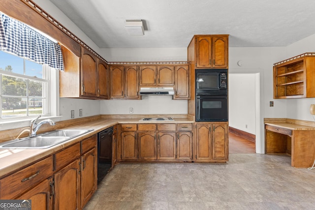 kitchen with black appliances and sink