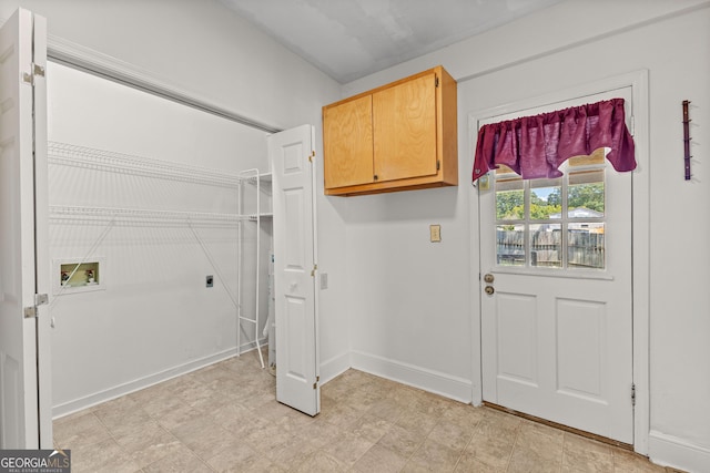 laundry area with hookup for a washing machine, cabinets, and hookup for an electric dryer