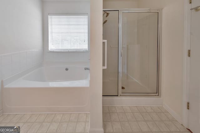 bathroom with separate shower and tub