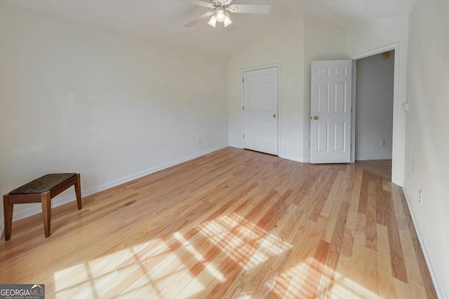 unfurnished bedroom featuring lofted ceiling, light hardwood / wood-style floors, and ceiling fan