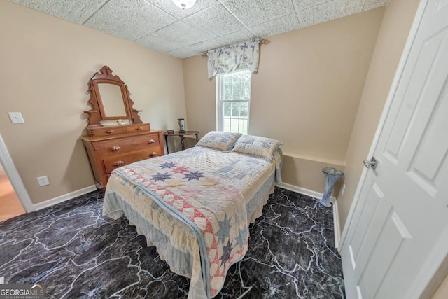 bedroom featuring a paneled ceiling