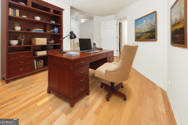 office space featuring ceiling fan and light hardwood / wood-style flooring