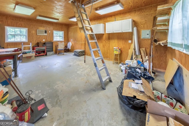 miscellaneous room with wooden walls