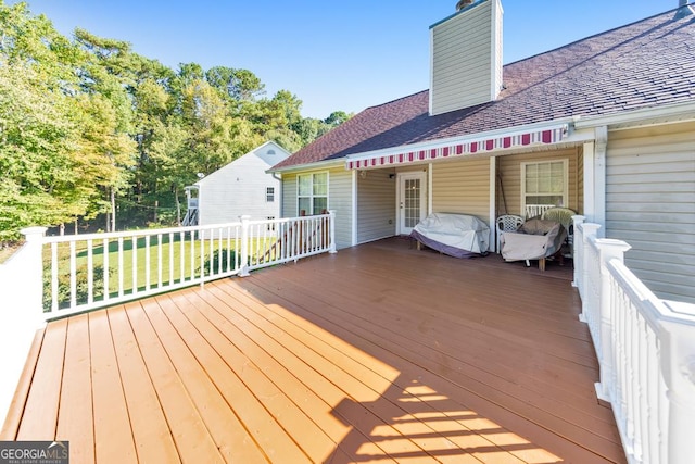 wooden deck with a yard