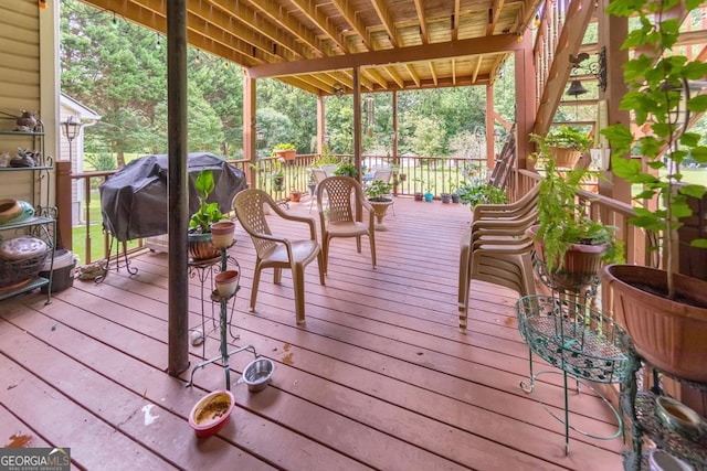 wooden deck featuring area for grilling