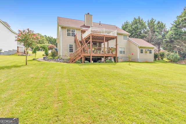 back of house featuring a deck and a lawn