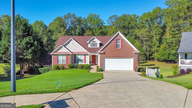 view of front of property featuring a garage and a front lawn