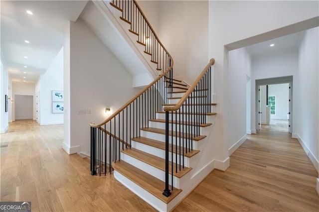 staircase featuring hardwood / wood-style floors