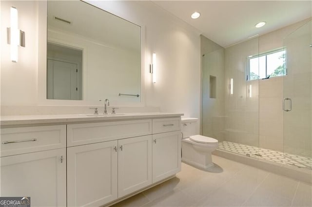 bathroom with toilet, an enclosed shower, vanity, and tile patterned flooring