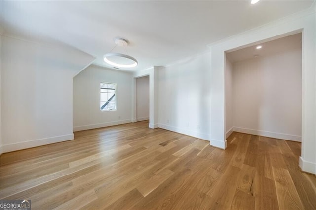 bonus room with light wood-type flooring