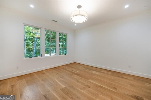 empty room with light hardwood / wood-style floors