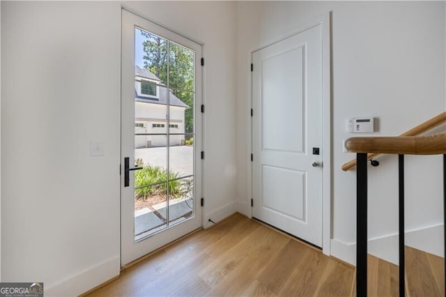 doorway to outside featuring light hardwood / wood-style flooring